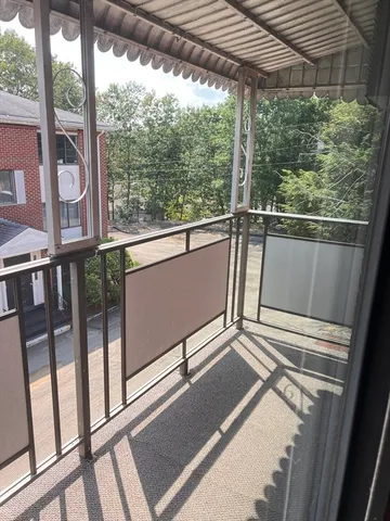 a view of balcony with furniture