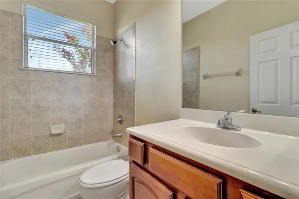 a bathroom with a sink toilet and bathtub