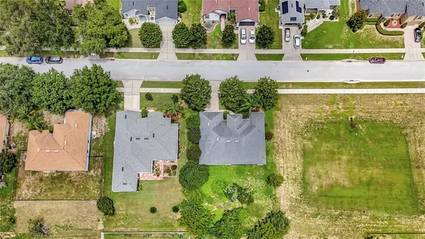 an aerial view of residential house with outdoor space and swimming pool