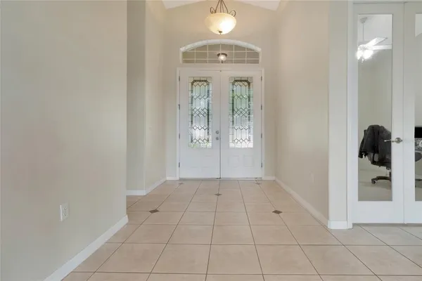 an empty room that has a mirror in it