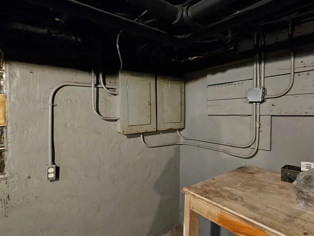 a bathroom with a shower and a sink