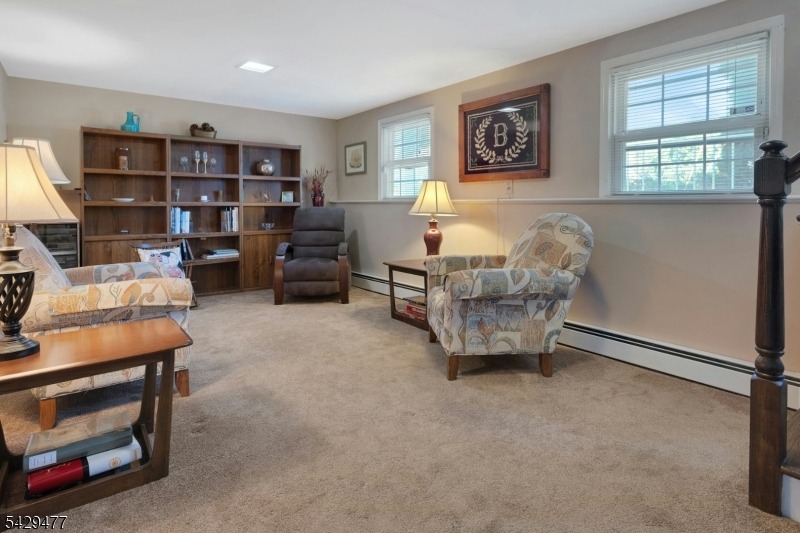 10 Ronald Terrace Springfield, NJ 07081 - Photo 21 of 36 a living room with furniture and a window