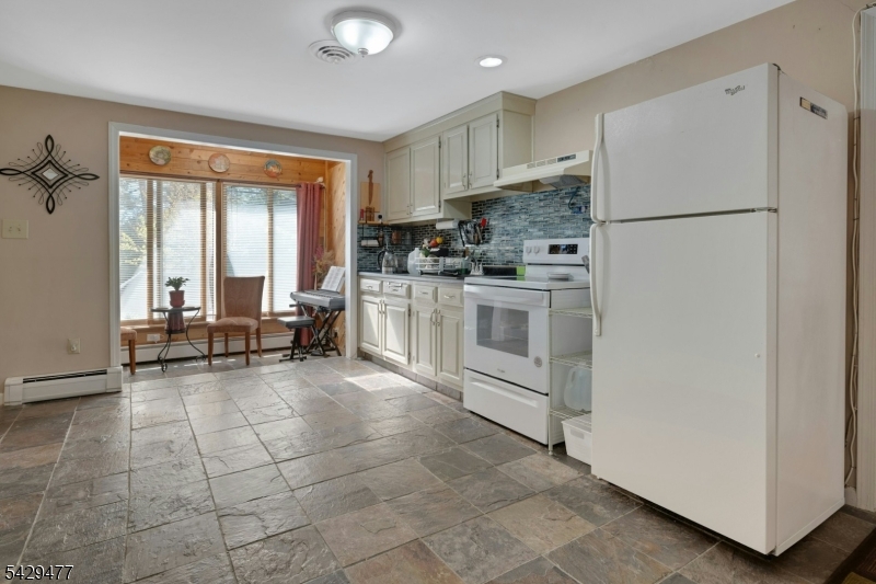 10 Ronald Terrace Springfield, NJ 07081 - Photo 24 of 36 a kitchen with stainless steel appliances a refrigerator sink and cabinets