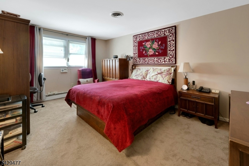 10 Ronald Terrace Springfield, NJ 07081 - Photo 28 of 36 a bedroom with a bed and a window