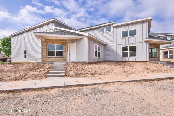 front view of a house with a dry yard