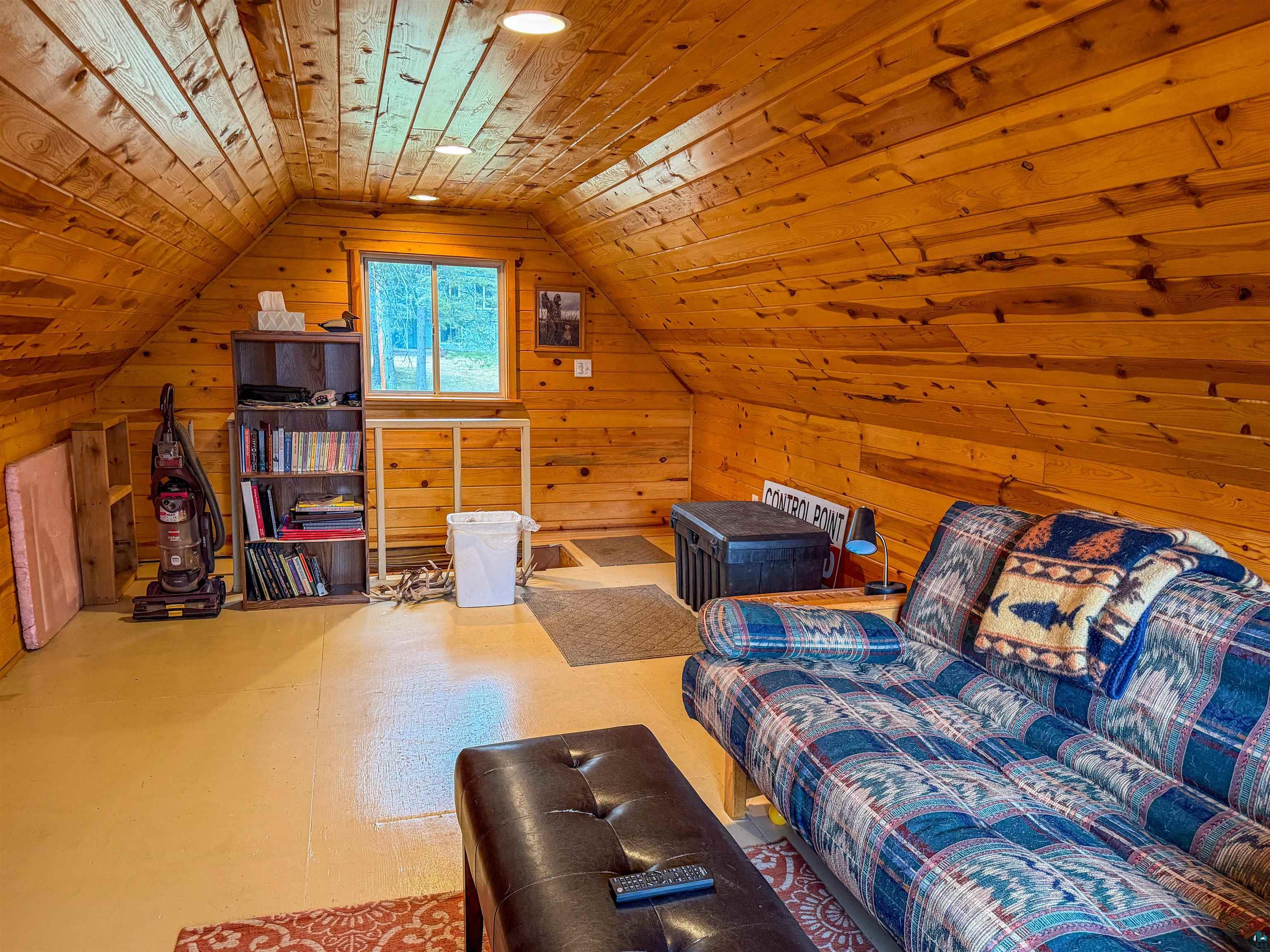 3704 Greysolon Road Duluth, MN 55804 - Photo 47 of 51 Sloping wood-paneled walls and ceiling with recessed lighting