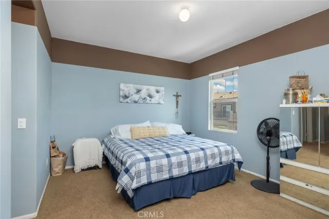 a bathroom with a double vanity sink mirror and shower