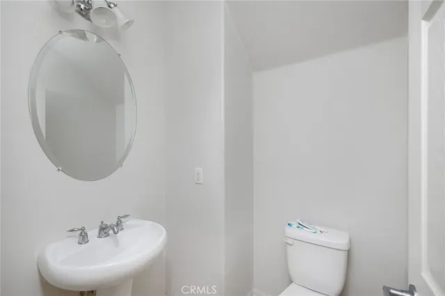 a bedroom with furniture and a wooden floor