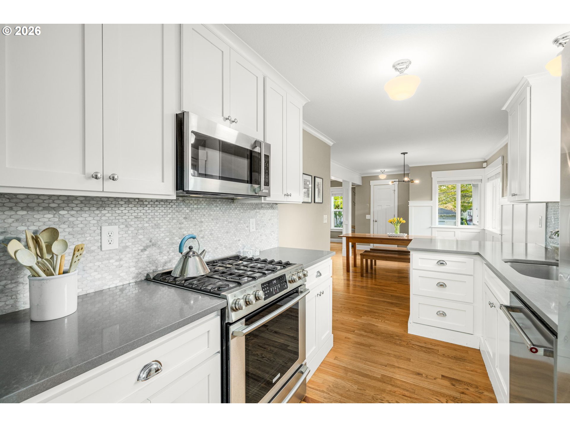 4117 Southeast Henderson Street Portland, OR 97202 - Photo 15 of 43 a kitchen with stainless steel appliances granite countertop a sink stove and cabinets