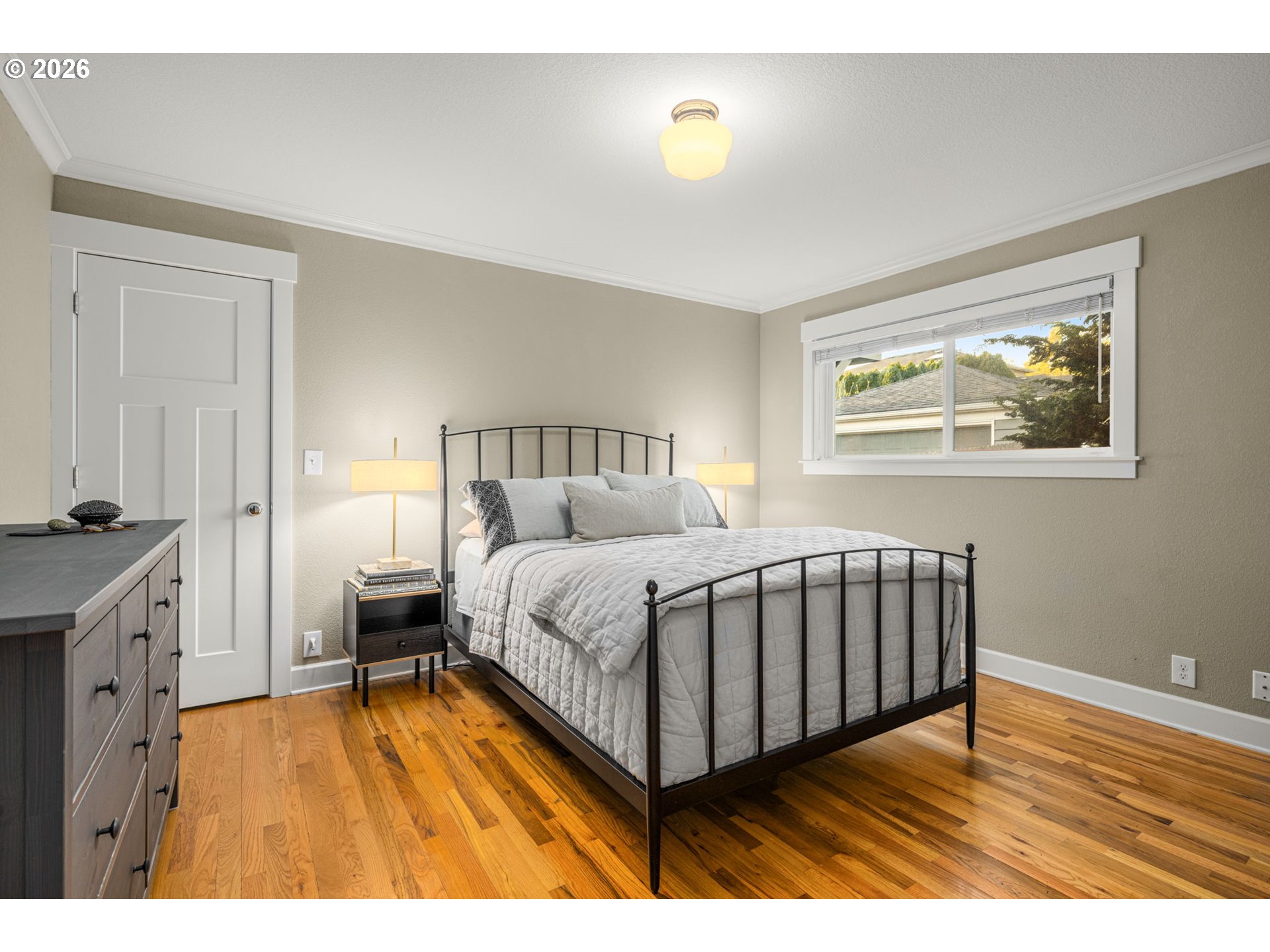 4117 Southeast Henderson Street Portland, OR 97202 - Photo 18 of 43 a spacious bedroom with a bed and a table