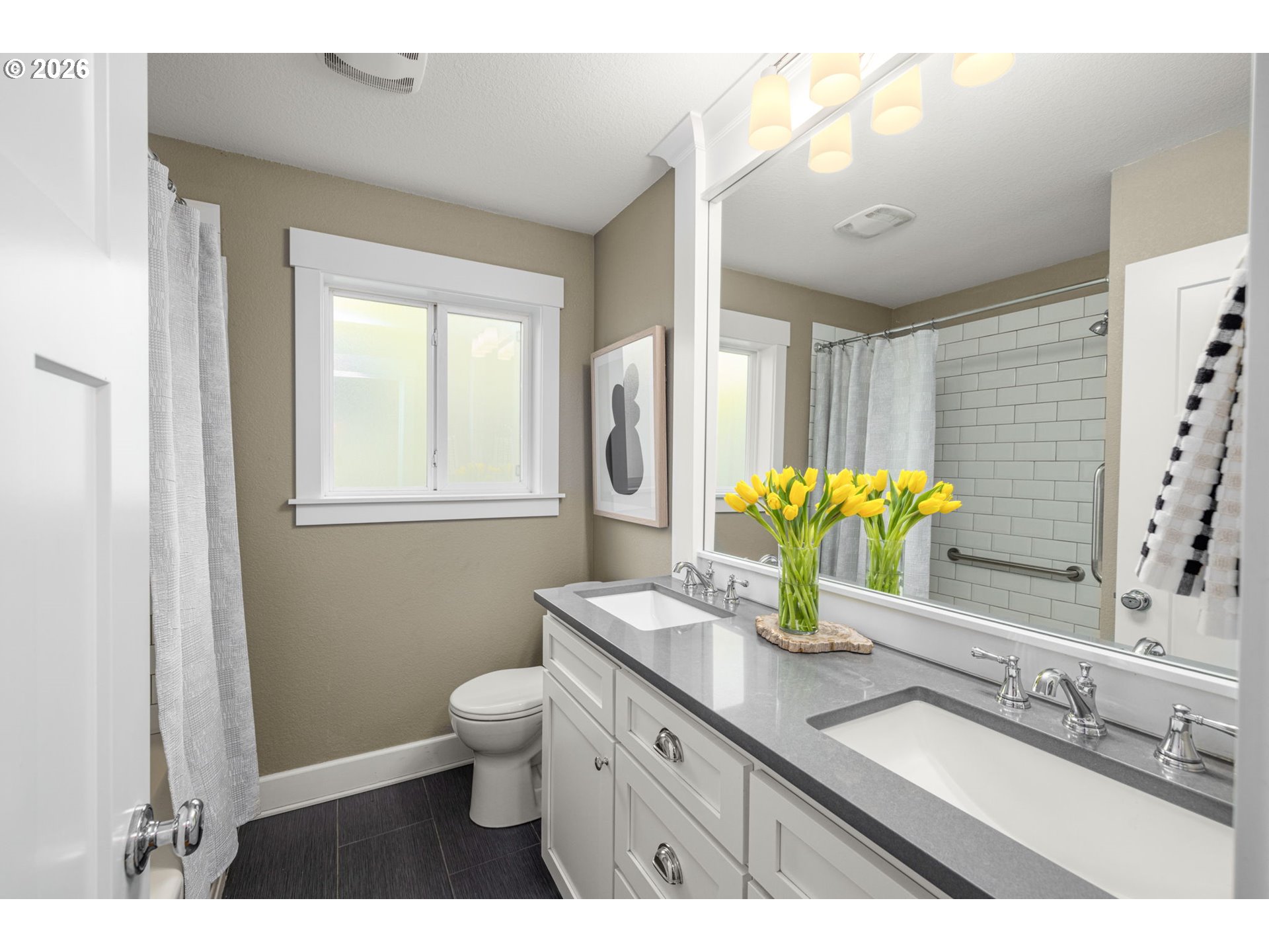 4117 Southeast Henderson Street Portland, OR 97202 - Photo 22 of 43 a bathroom with a granite countertop sink a toilet and a mirror
