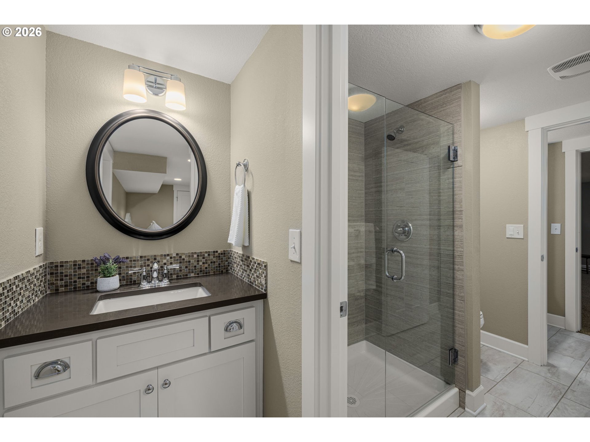 4117 Southeast Henderson Street Portland, OR 97202 - Photo 28 of 43 a bathroom with a sink mirror and shower