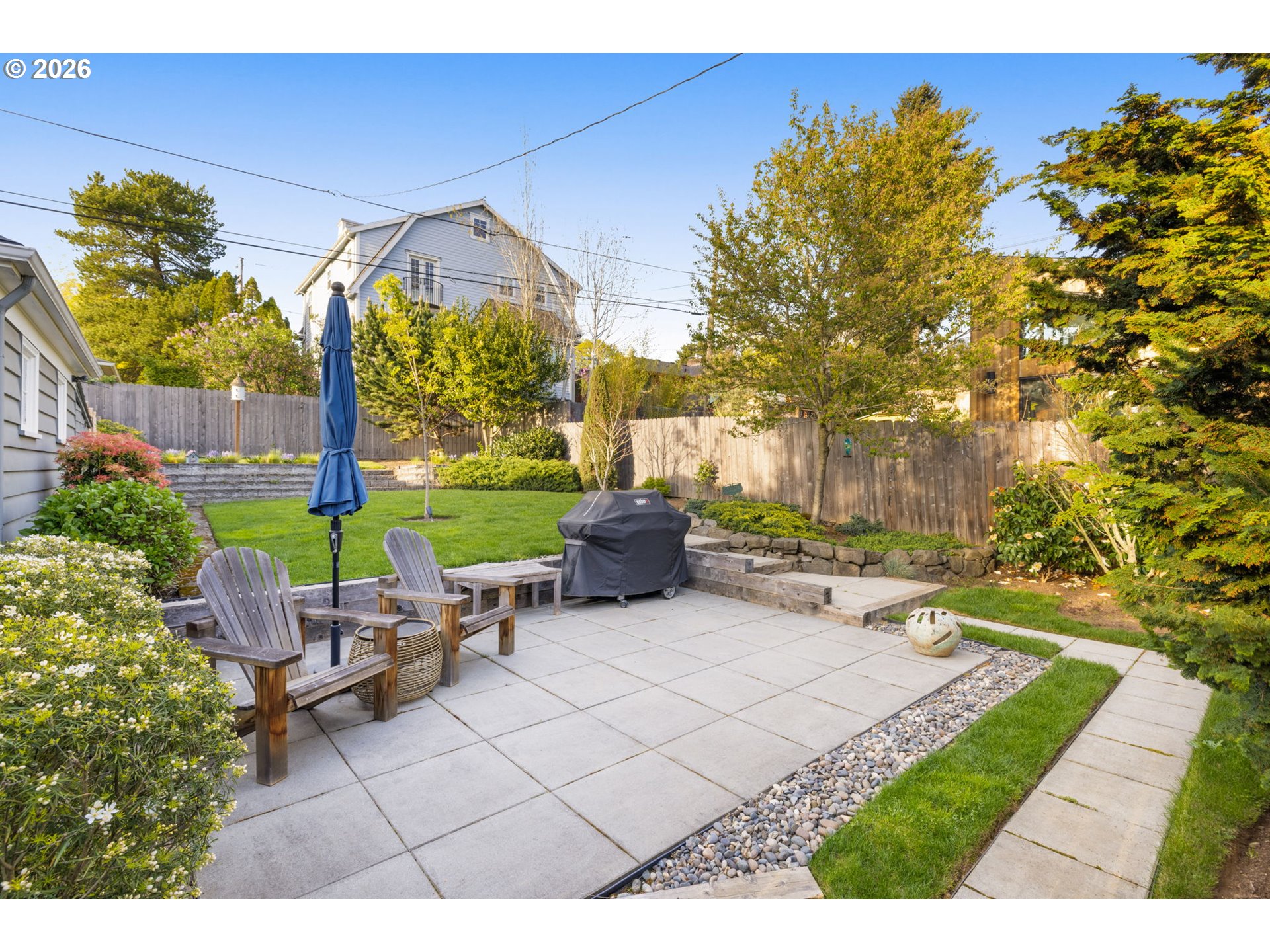 4117 Southeast Henderson Street Portland, OR 97202 - Photo 31 of 43 a backyard of a house with table and chairs