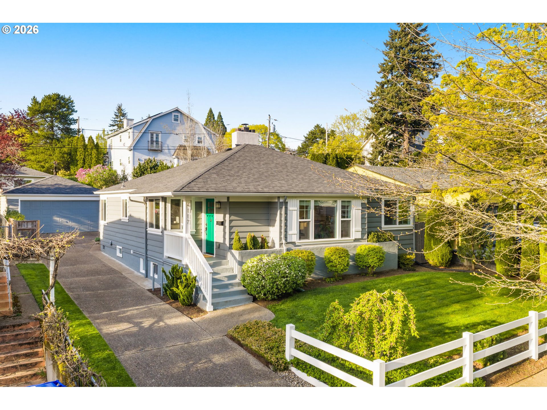 4117 Southeast Henderson Street Portland, OR 97202 - Photo 4 of 43 a front view of a house with garden