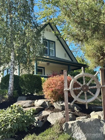a front view of a house with garden