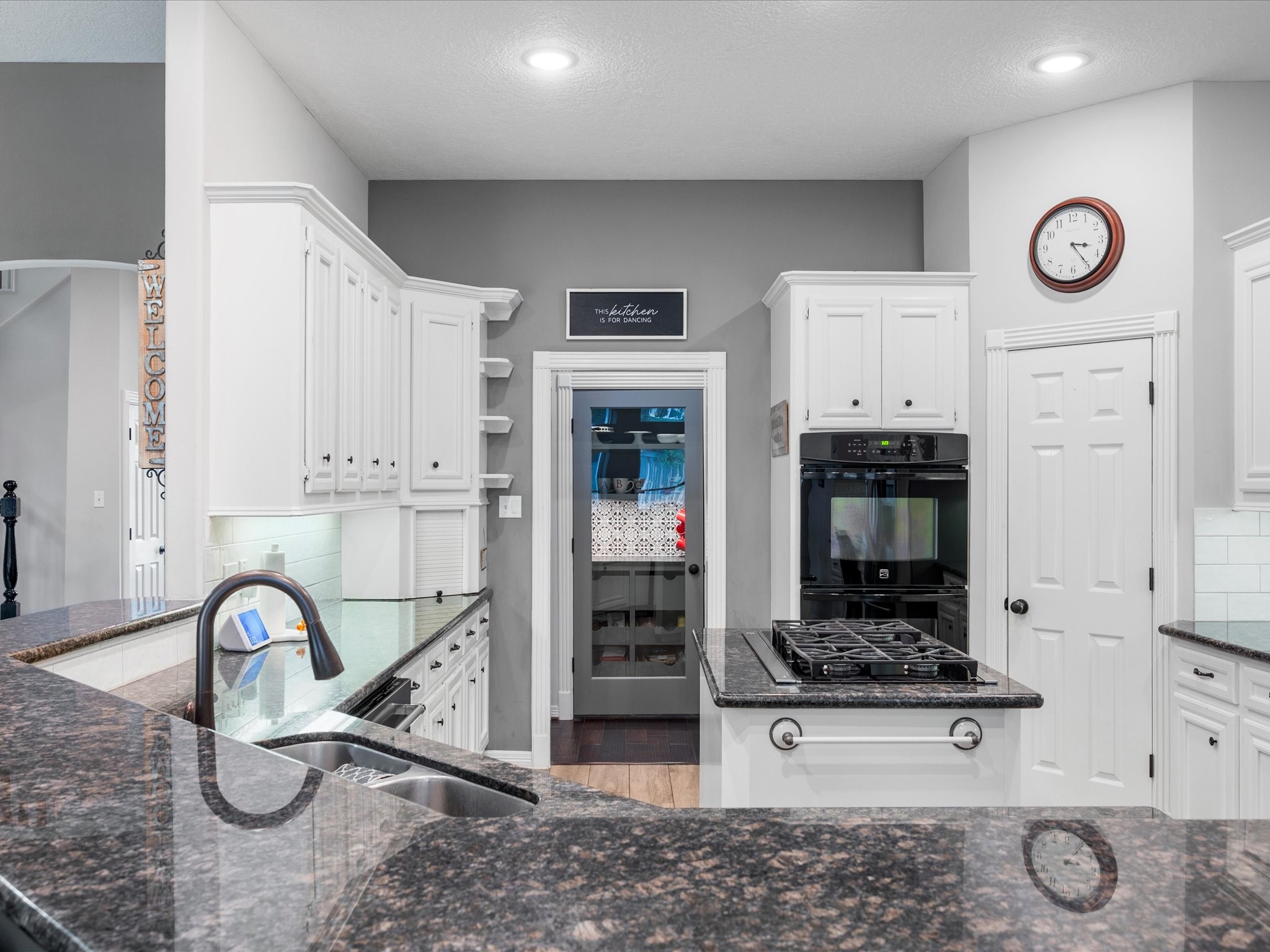 5910 Center Ct Drive Spring, TX 77379 - Photo 15 of 50 The kitchen showcases a full renovation with updated cabinetry, modern finishes, and thoughtfully selected details that elevate both style and functionality.