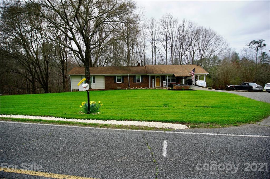 3038 Dravo Road Shelby, NC 28152 - Photo 1 of 33 a front view of a house with a yard and trees