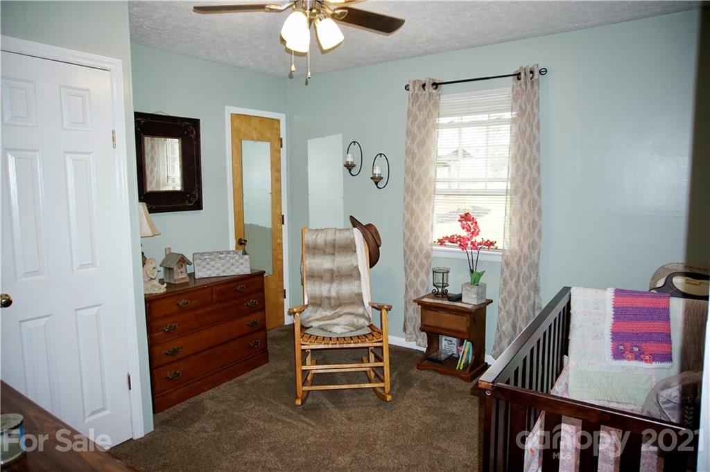 3038 Dravo Road Shelby, NC 28152 - Photo 11 of 33 a bed room with furniture and wooden floor