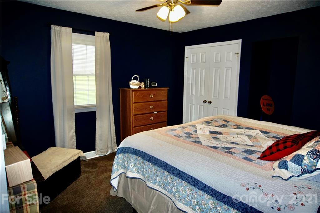 3038 Dravo Road Shelby, NC 28152 - Photo 13 of 33 a bedroom with a bed and a dresser in it