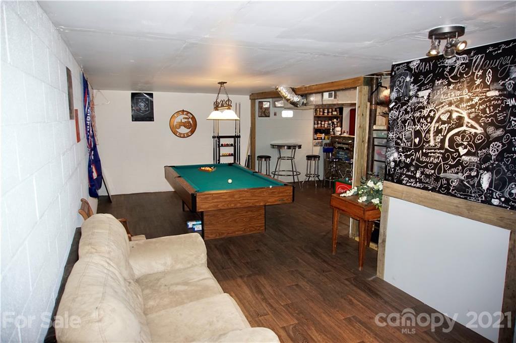 3038 Dravo Road Shelby, NC 28152 - Photo 21 of 33 a living room with furniture and a wall painting