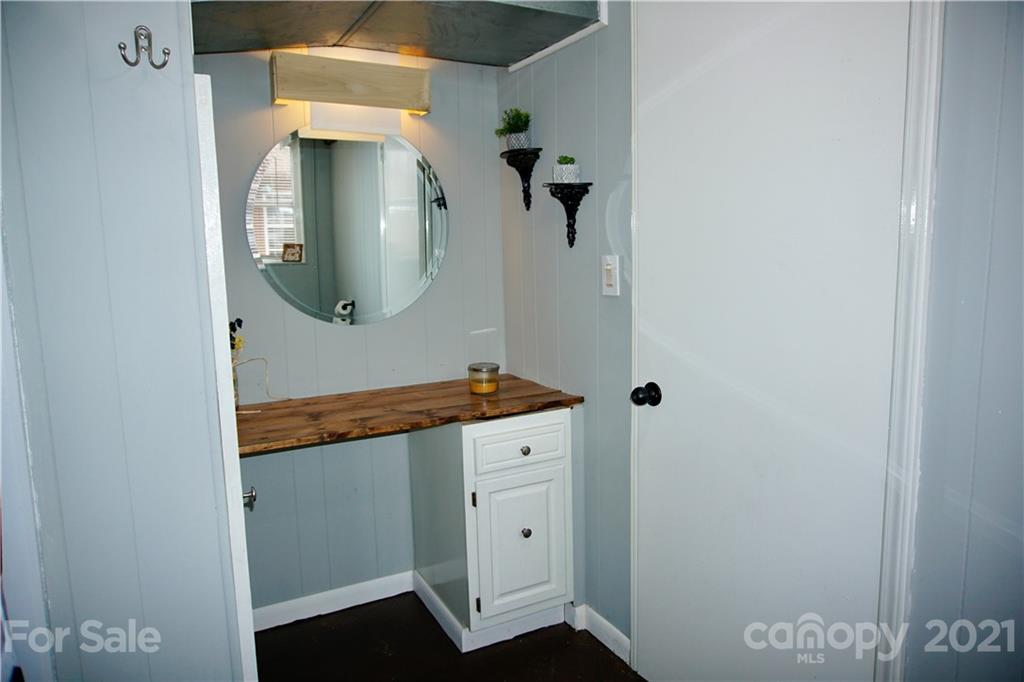 3038 Dravo Road Shelby, NC 28152 - Photo 26 of 33 a bathroom with a mirror and a sink