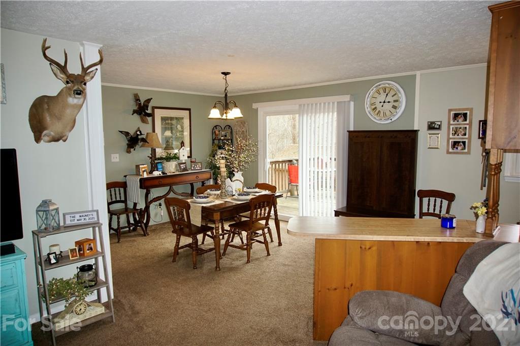 3038 Dravo Road Shelby, NC 28152 - Photo 6 of 33 a living room with furniture and a chandelier