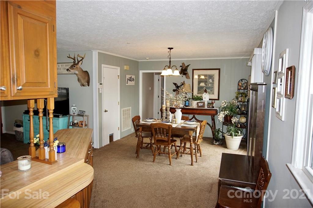 3038 Dravo Road Shelby, NC 28152 - Photo 7 of 33 a view of a dining room with furniture and chandelier