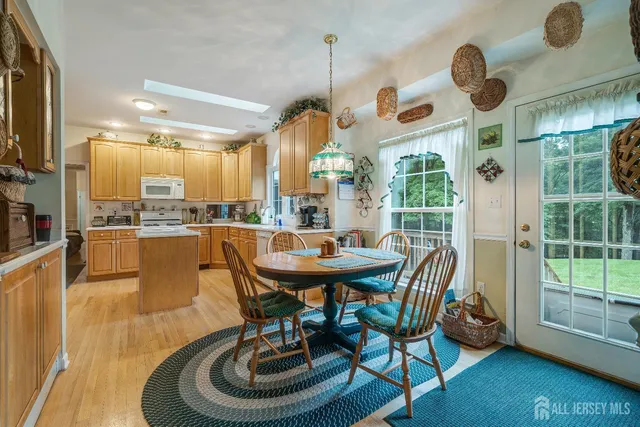 a bedroom with a bed and a flat tv screen on the dresser