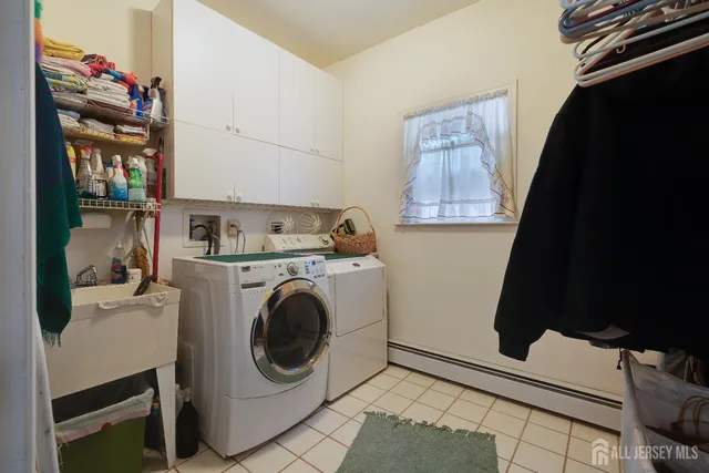 a bathroom with a tub sink and shower