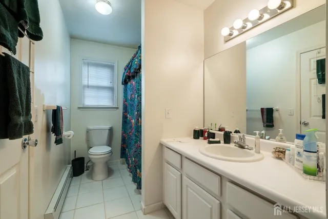 a bed room with a bed and a chair