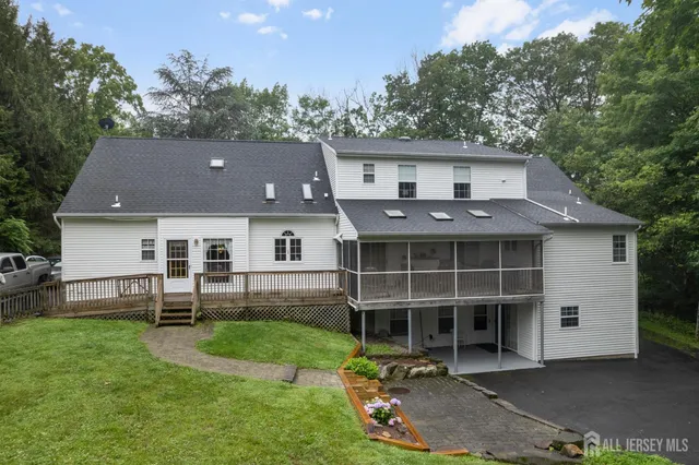 a view of room with window and a ceiling fan