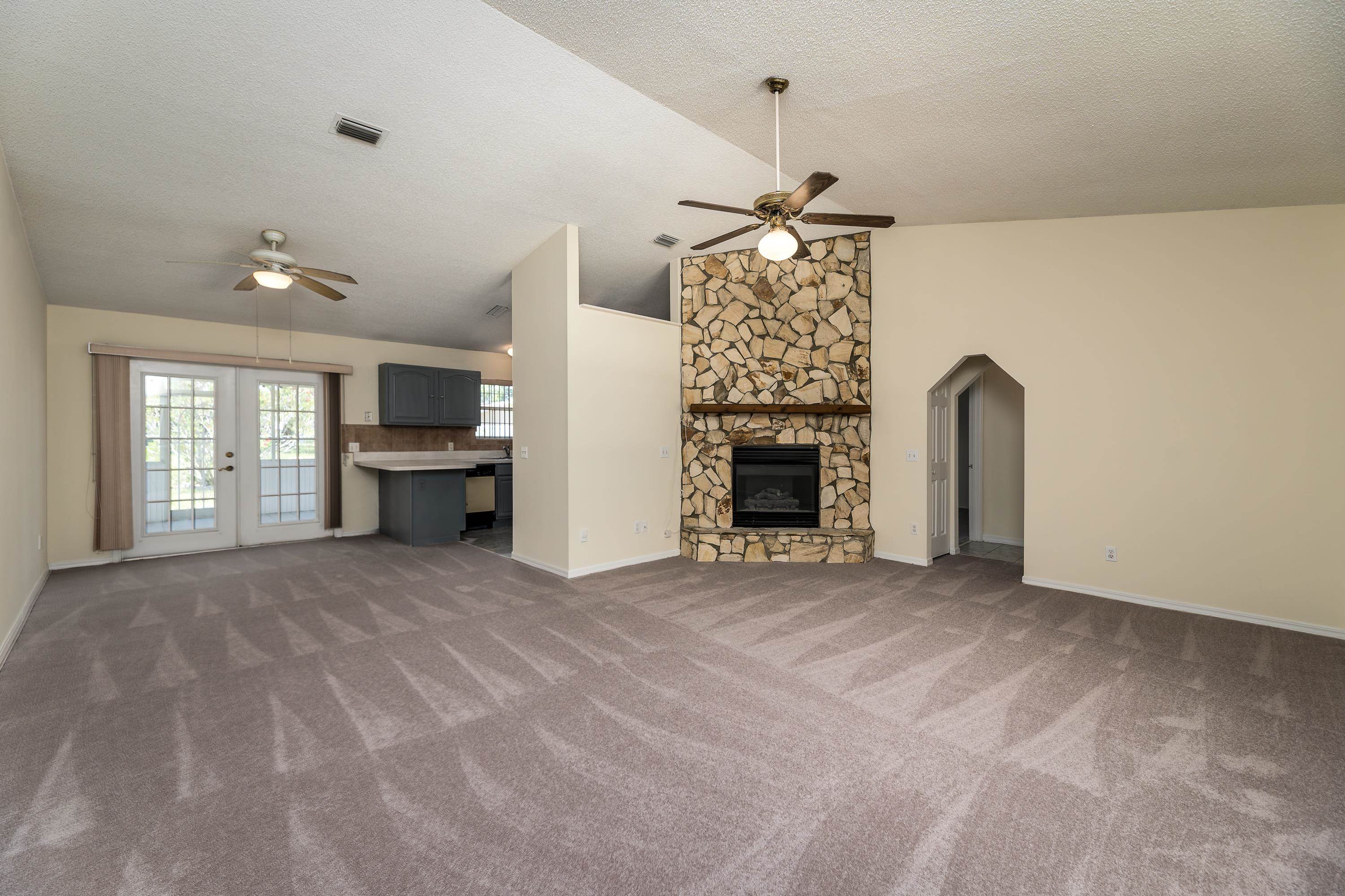 112 Gentian Road St. Augustine, FL 32086 - Photo 14 of 33 a view of empty room with a fireplace