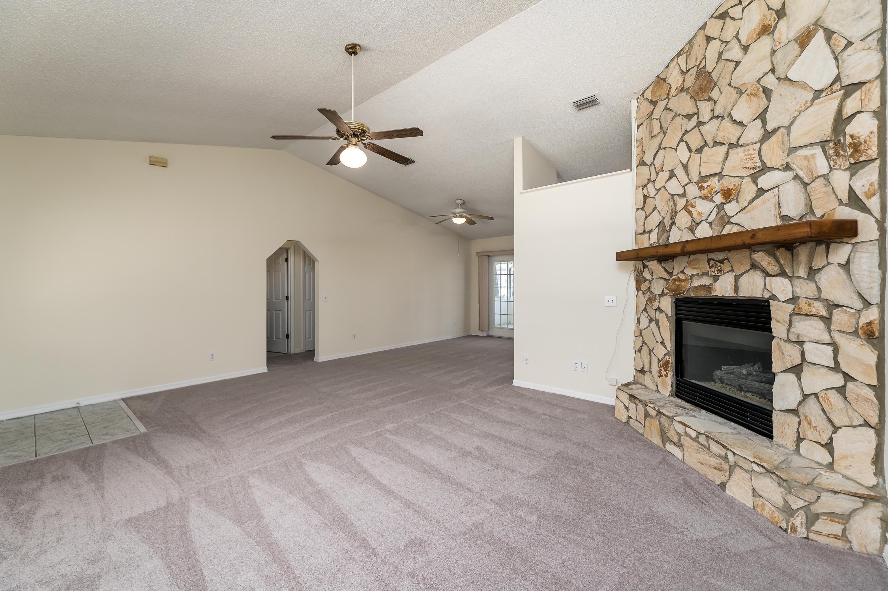 112 Gentian Road St. Augustine, FL 32086 - Photo 15 of 33 an empty room with a fireplace