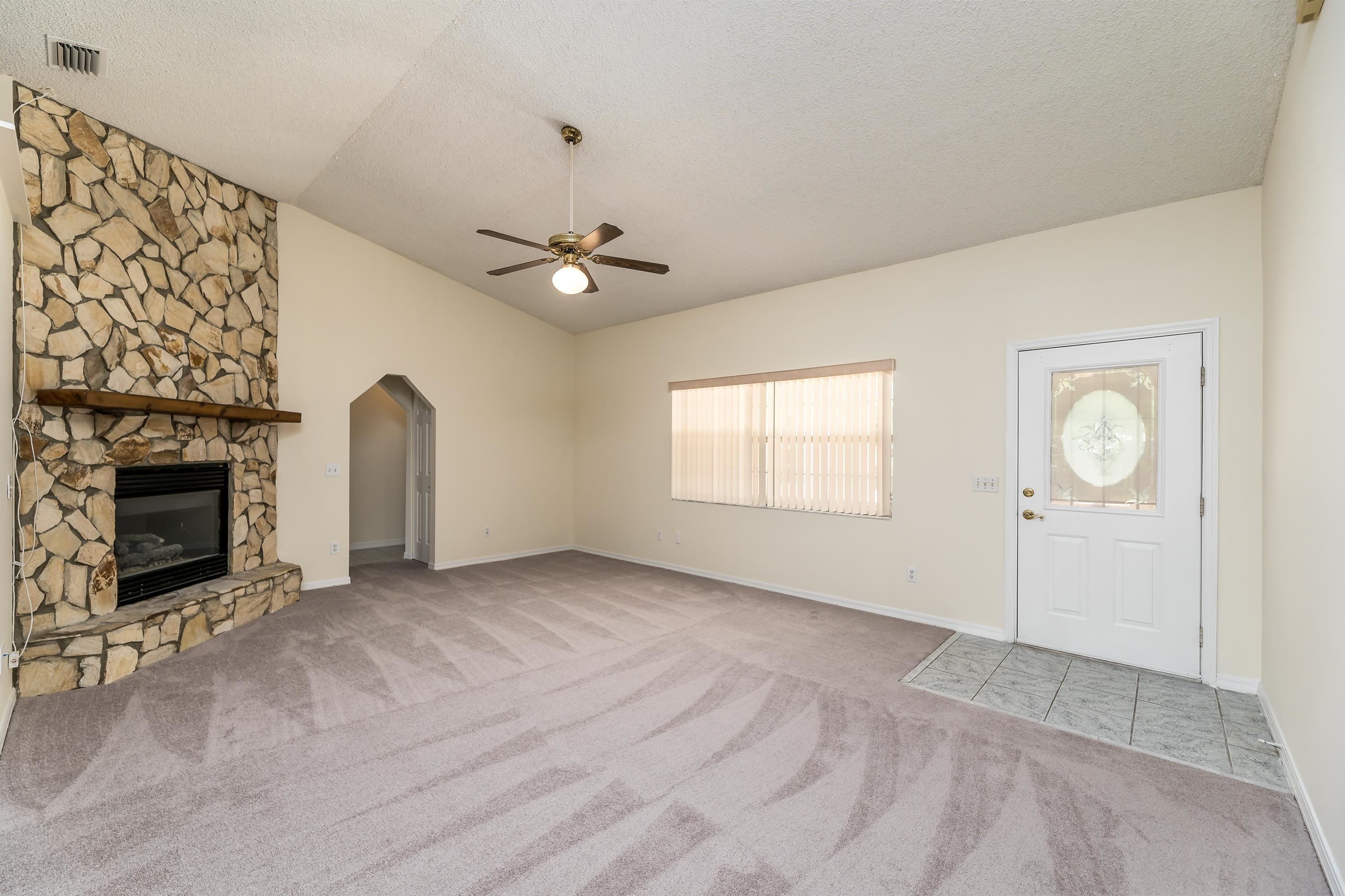 112 Gentian Road St. Augustine, FL 32086 - Photo 17 of 33 an empty room with windows and fireplace