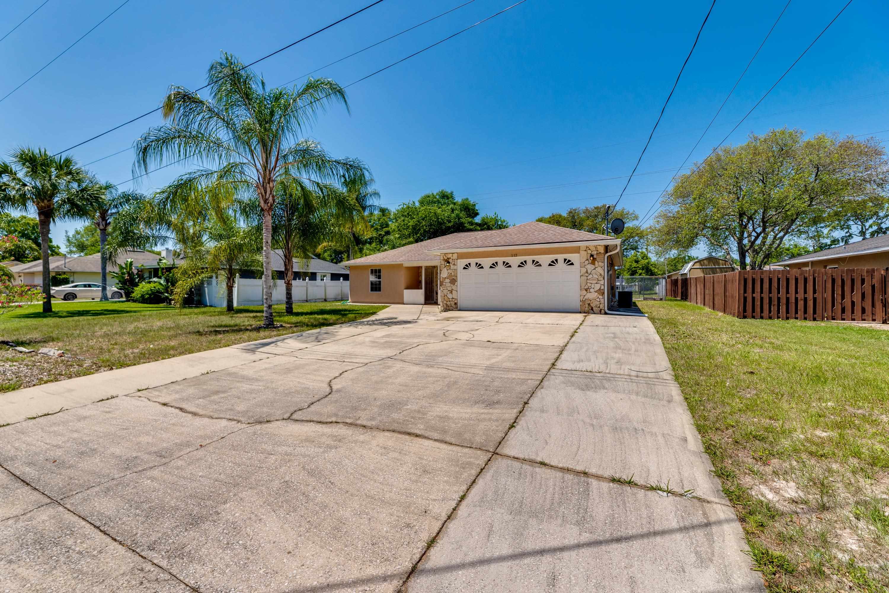 112 Gentian Road St. Augustine, FL 32086 - Photo 2 of 33 a view of house with outdoor space and palm tree