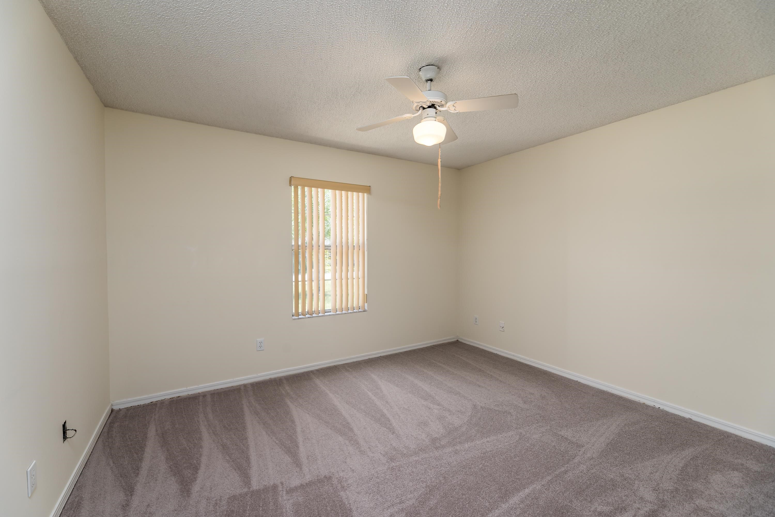 112 Gentian Road St. Augustine, FL 32086 - Photo 22 of 33 wooden floor in an empty room with a window