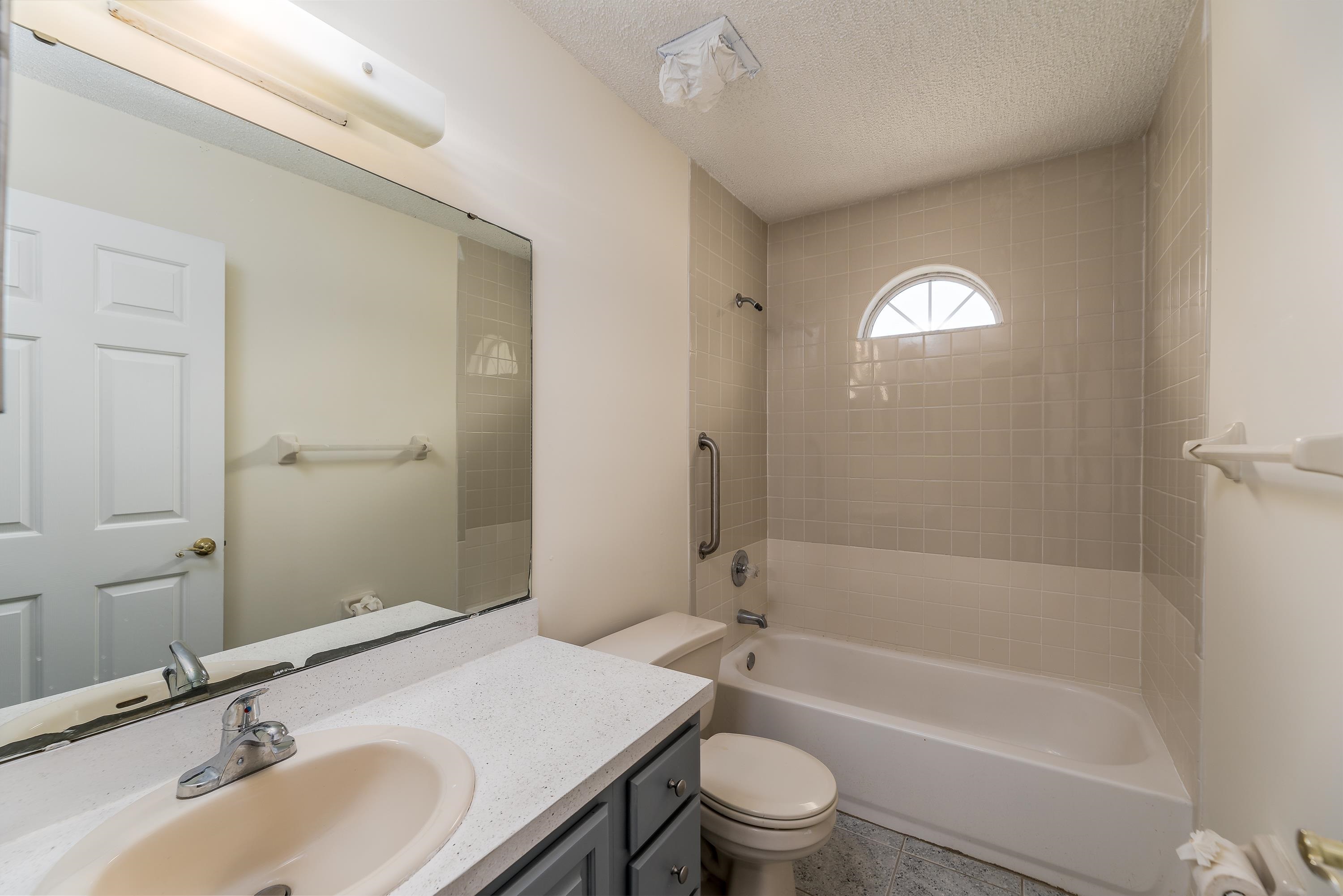 112 Gentian Road St. Augustine, FL 32086 - Photo 24 of 33 a bathroom with a sink toilet and shower