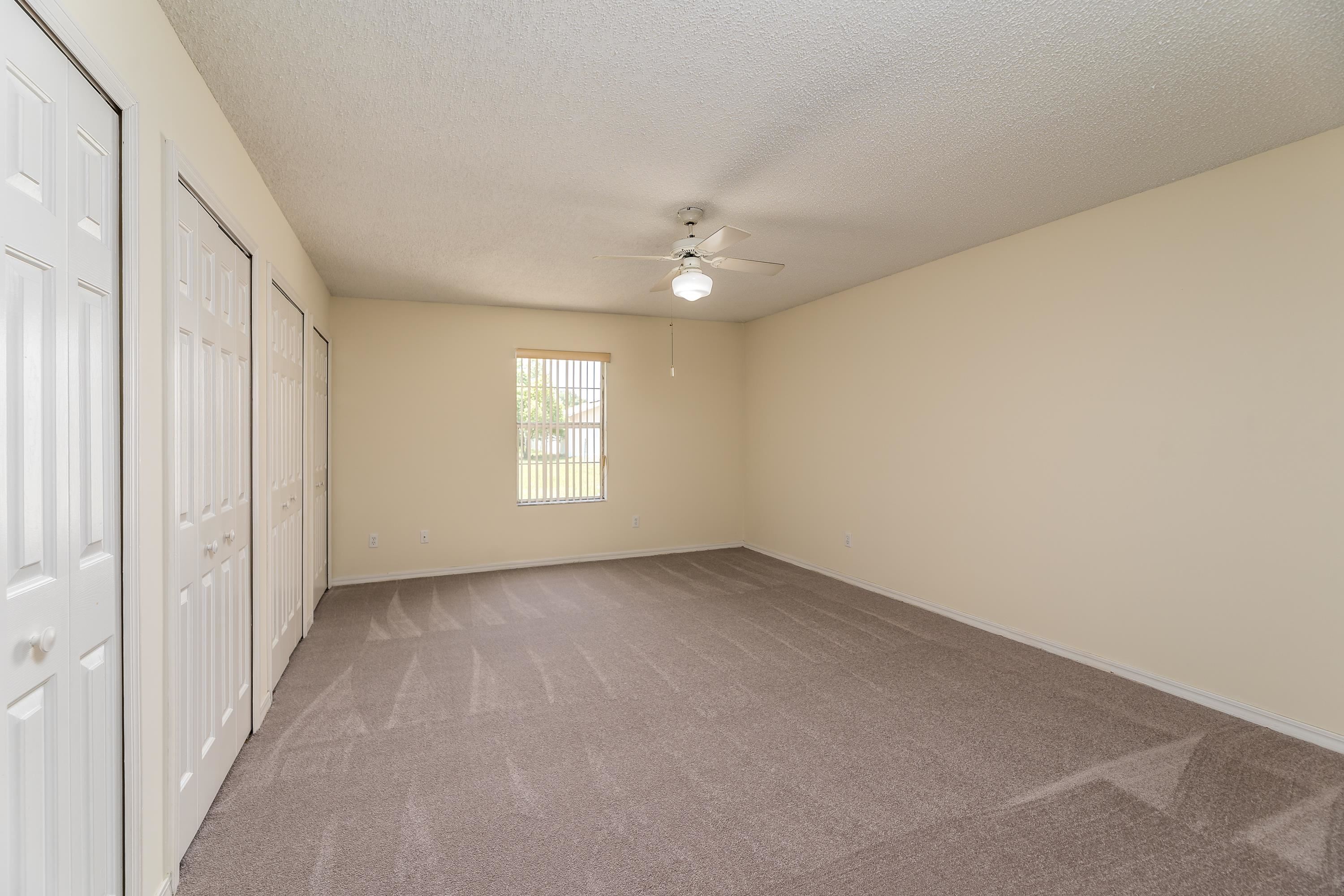 112 Gentian Road St. Augustine, FL 32086 - Photo 27 of 33 wooden floor in an empty room with a window