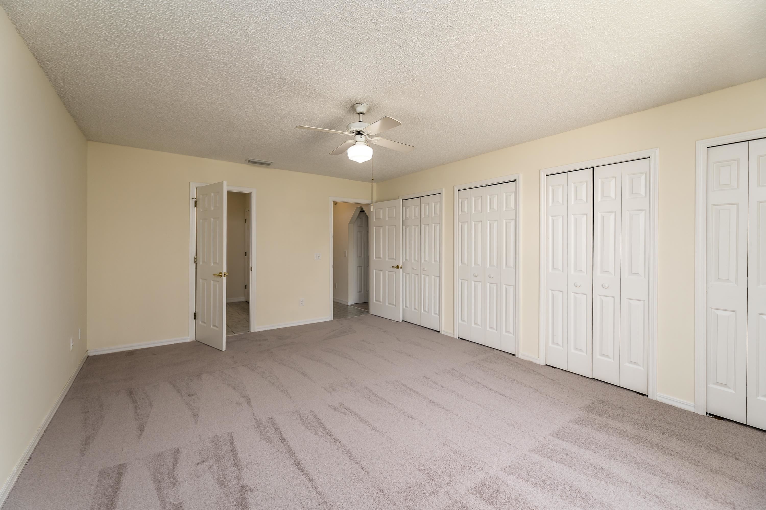 112 Gentian Road St. Augustine, FL 32086 - Photo 29 of 33 a view of an empty room with a ceiling fan