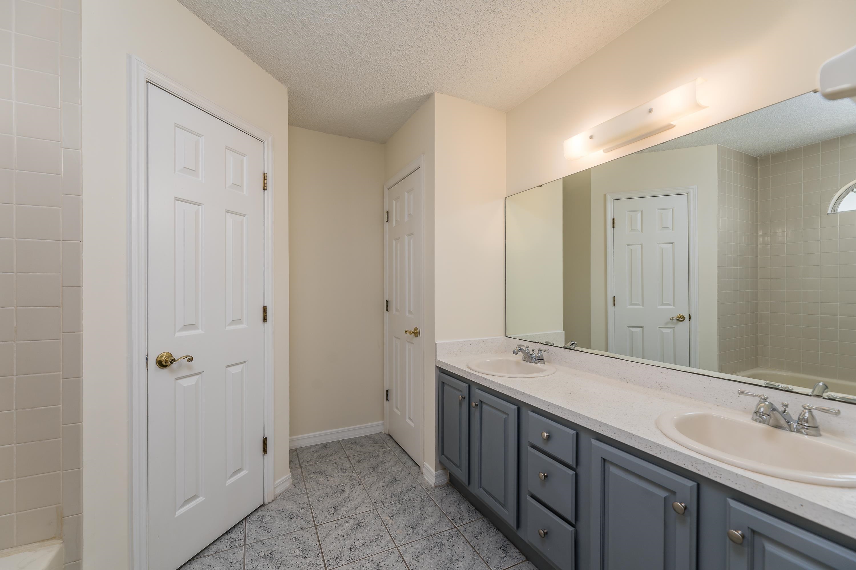 112 Gentian Road St. Augustine, FL 32086 - Photo 31 of 33 a bathroom with double vanity sinks and a shower