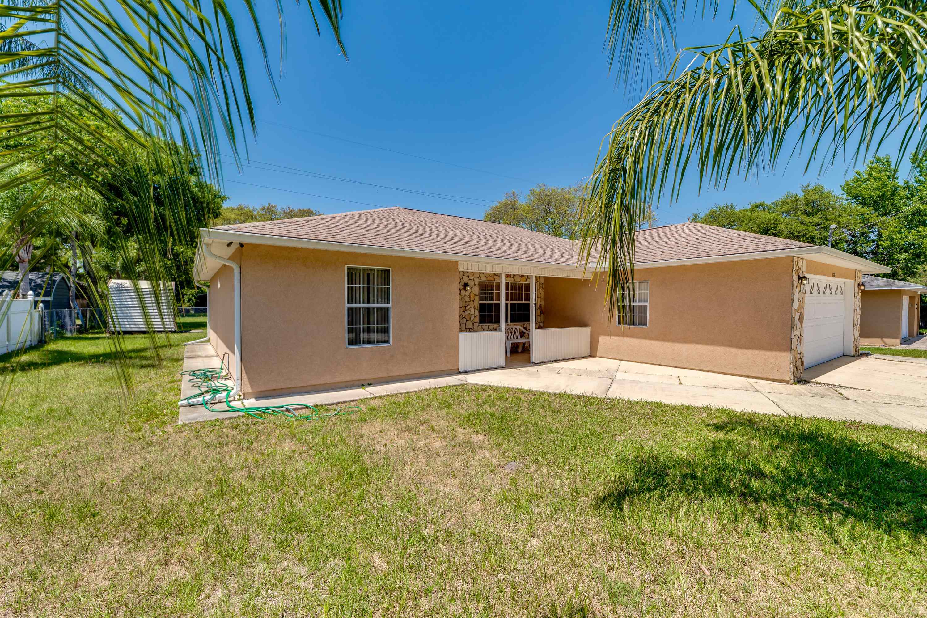 112 Gentian Road St. Augustine, FL 32086 - Photo 5 of 33 a view of a house with backyard and garden