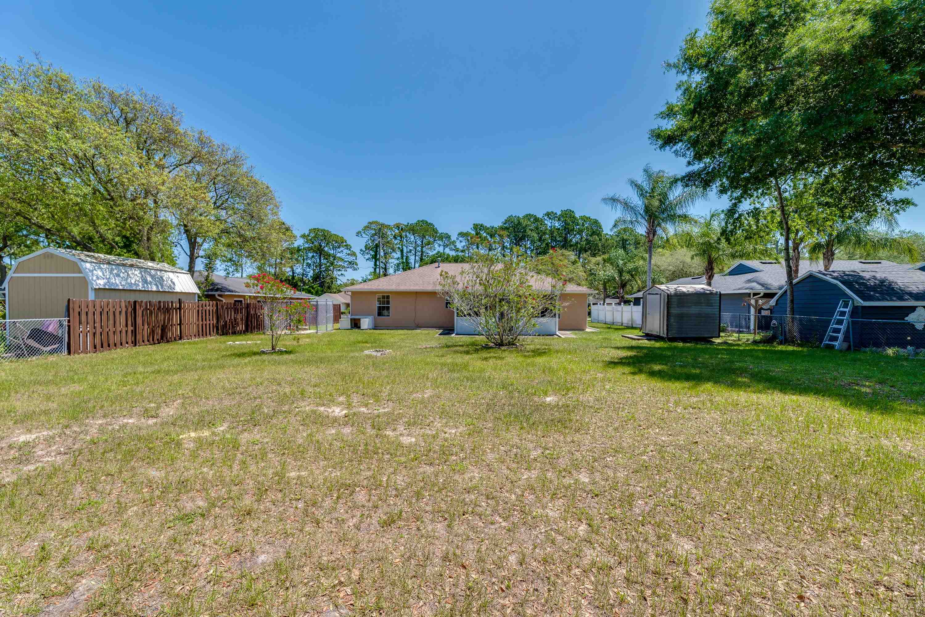 112 Gentian Road St. Augustine, FL 32086 - Photo 9 of 33 a house view with a garden space