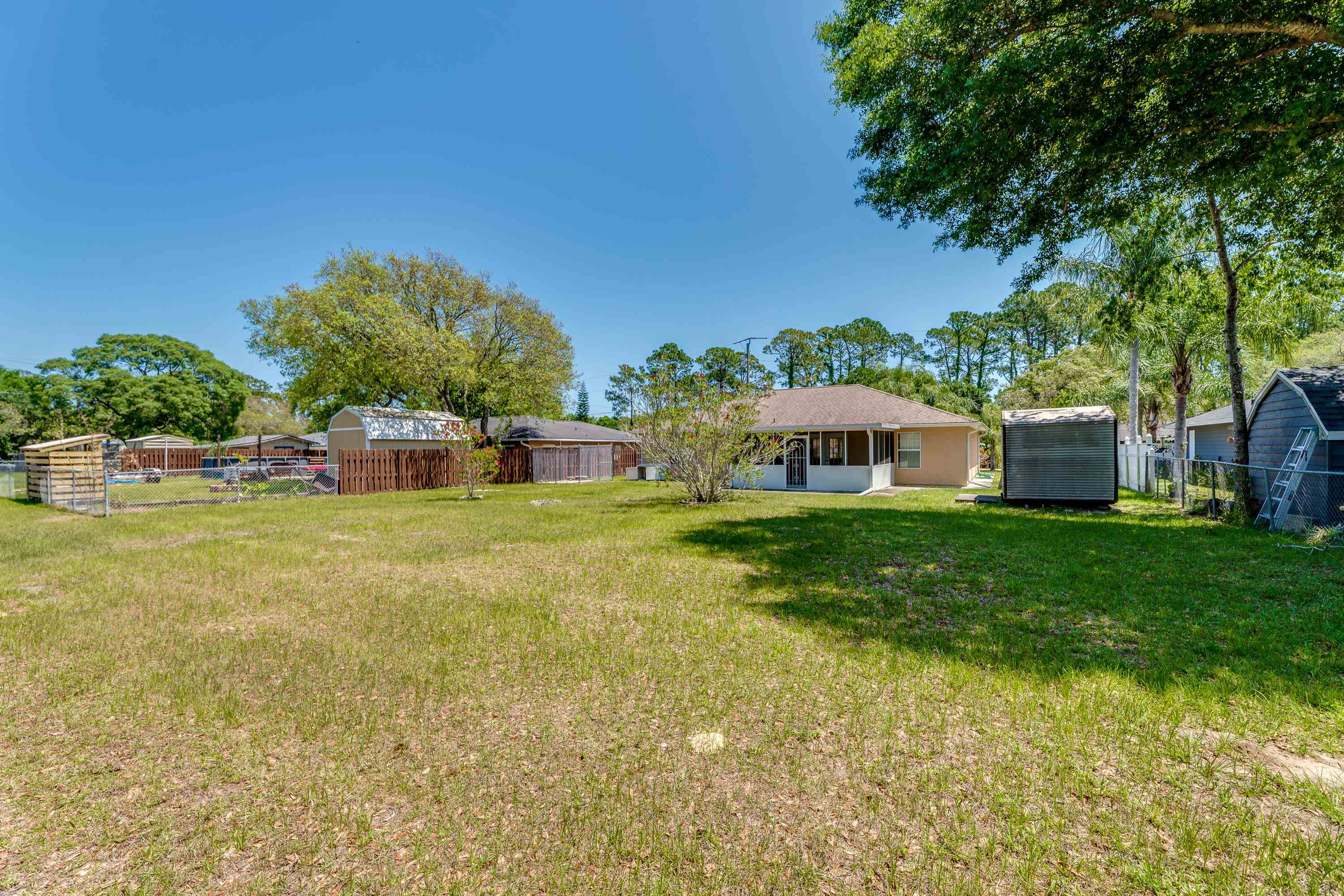 112 Gentian Road St. Augustine, FL 32086 - Photo 10 of 33 a front view of a house with garden