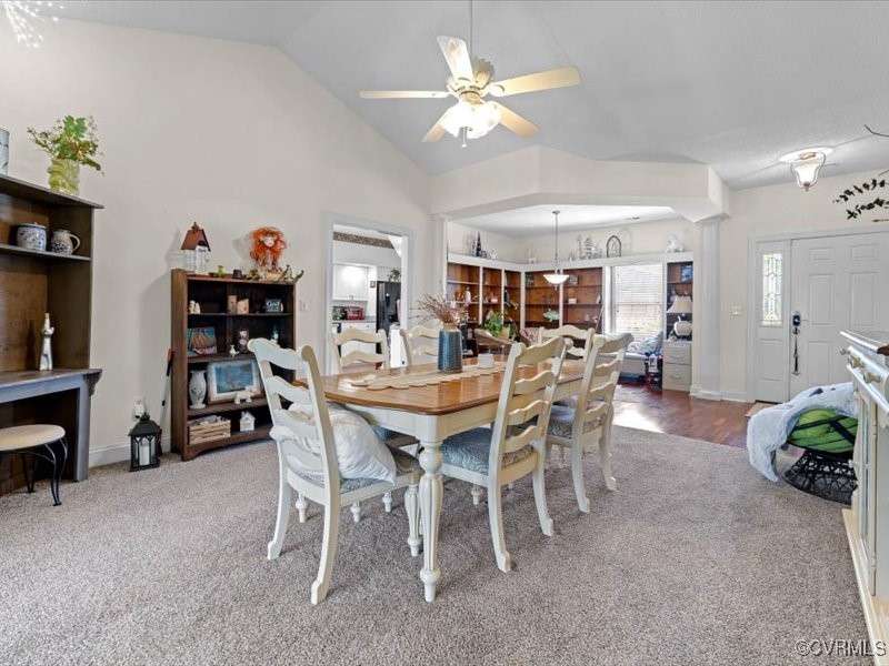 225 Lighthouse Pointe Hopewell, VA 23860 - Photo 11 of 32 a view of a dining room with furniture and a chandelier fan