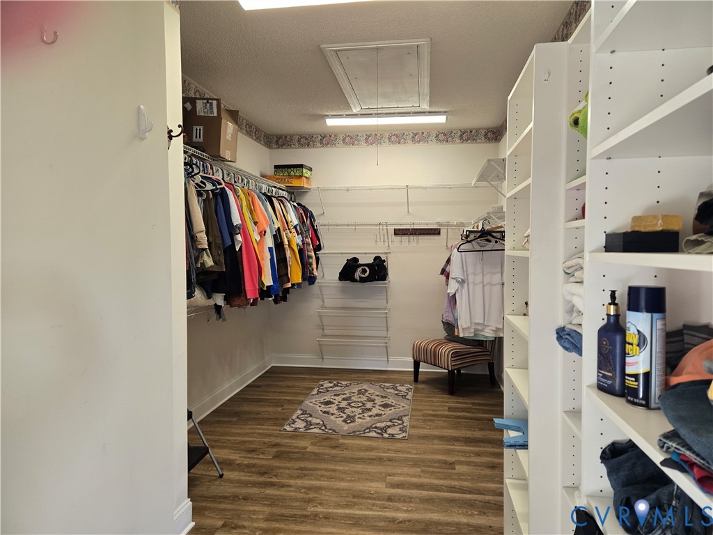 225 Lighthouse Pointe Hopewell, VA 23860 - Photo 23 of 32 a view of walk in closet with clothes and shoes