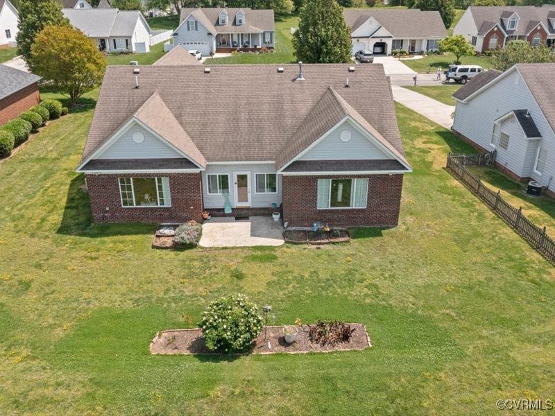 225 Lighthouse Pointe Hopewell, VA 23860 - Photo 26 of 32 a aerial view of a house with a yard table and chairs