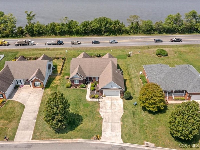225 Lighthouse Pointe Hopewell, VA 23860 - Photo 29 of 32 an aerial view of a house with a swimming pool