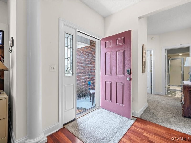 225 Lighthouse Pointe Hopewell, VA 23860 - Photo 4 of 32 a view of a hallway with wooden floor and a bathroom