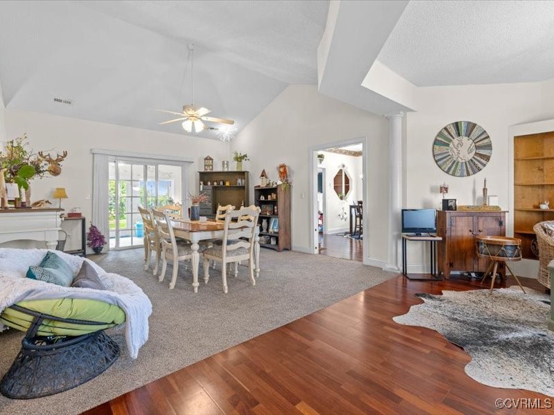 225 Lighthouse Pointe Hopewell, VA 23860 - Photo 9 of 32 a living room with furniture a dining table and a large window