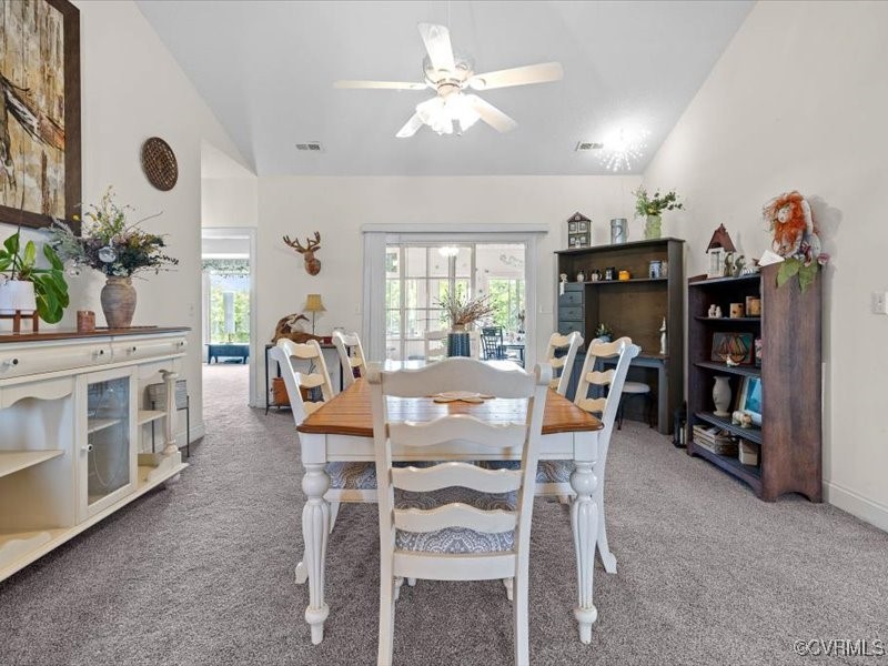225 Lighthouse Pointe Hopewell, VA 23860 - Photo 10 of 32 a view of a dining room with furniture and a chandelier fan